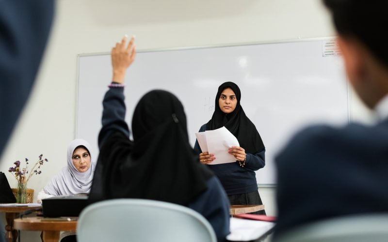 Diverse Muslim children studying in classroom
